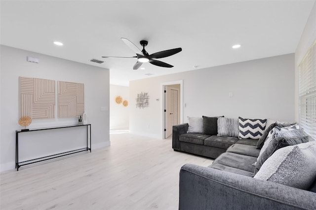 living room with visible vents, baseboards, light wood-type flooring, recessed lighting, and a ceiling fan