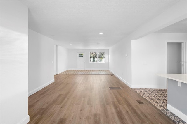 spare room with light wood-type flooring