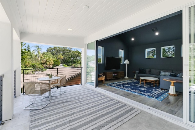 exterior space with visible vents, recessed lighting, wooden ceiling, and vaulted ceiling