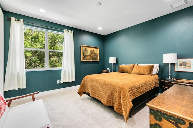 carpeted bedroom featuring visible vents, recessed lighting, and baseboards