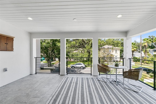 unfurnished sunroom featuring a healthy amount of sunlight