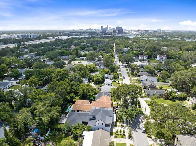 birds eye view of property featuring a city view and a residential view