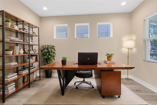 office featuring recessed lighting, baseboards, and light wood-style flooring