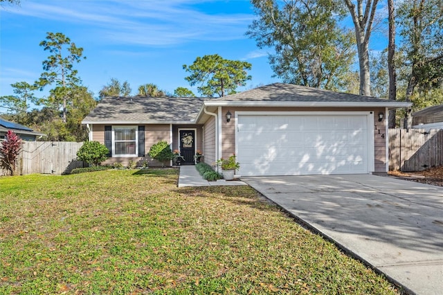 single story home featuring a garage and a front yard