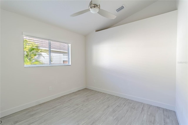 unfurnished room featuring ceiling fan, lofted ceiling, and light wood-type flooring