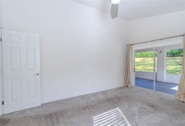 carpeted empty room featuring ceiling fan