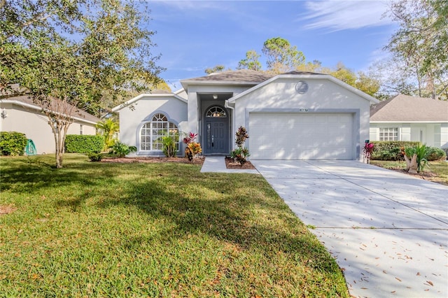 ranch-style home featuring a garage and a front yard