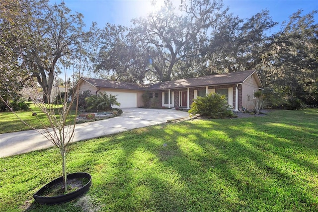 ranch-style home with a garage and a front yard