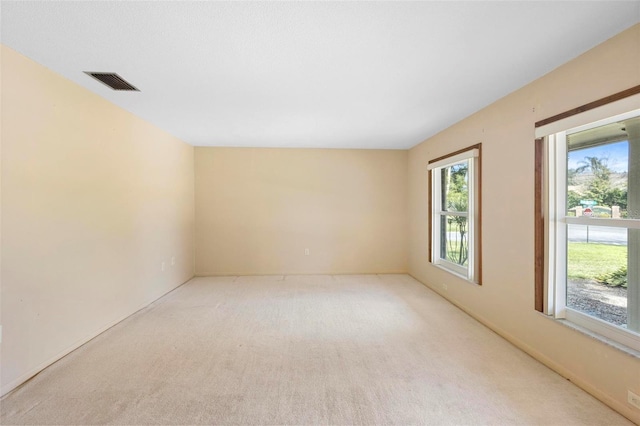 empty room with light colored carpet