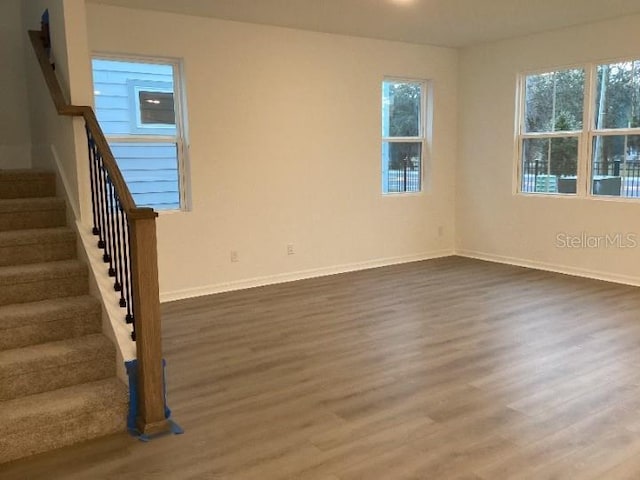 spare room featuring dark wood-type flooring