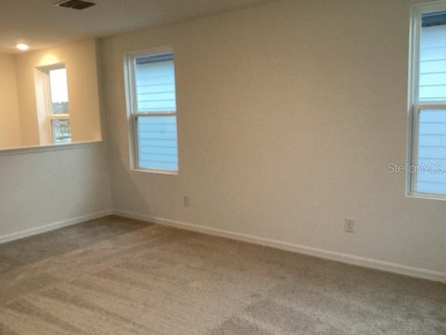 spare room with carpet floors