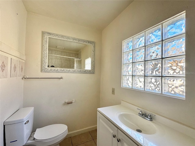 bathroom featuring a shower with shower curtain, vanity, toilet, and tile patterned flooring