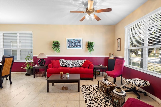 tiled living room with ceiling fan