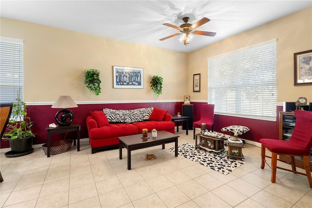 tiled living room with ceiling fan