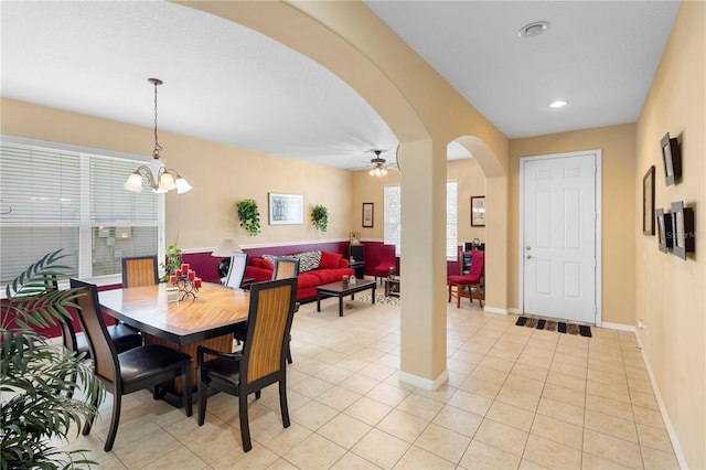 dining room with light tile patterned floors and ceiling fan