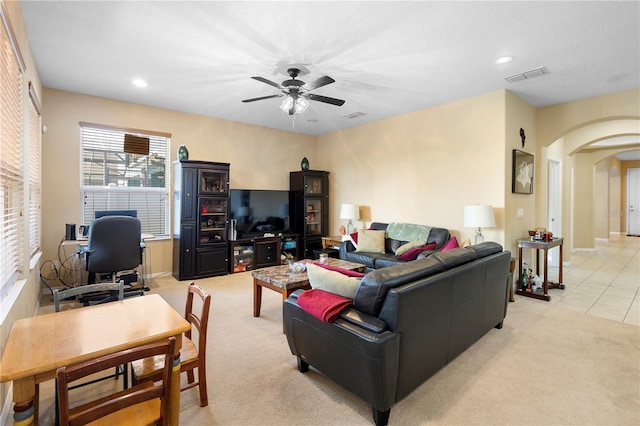 living room featuring ceiling fan and light carpet