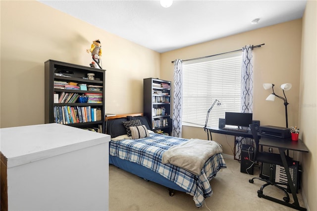 bedroom with light colored carpet