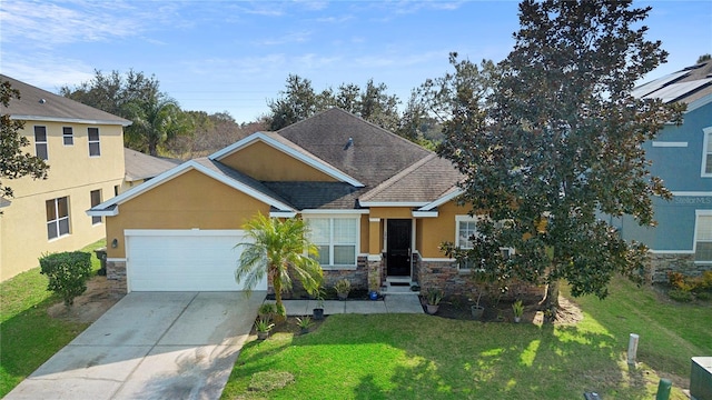 view of front of house with a garage and a front lawn