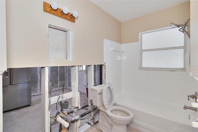 bathroom featuring shower / bathtub combination and toilet