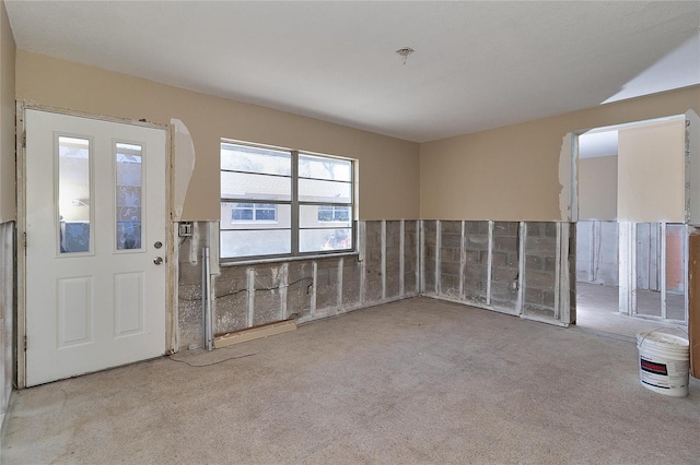 spare room featuring light colored carpet