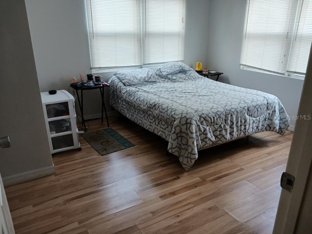 bedroom with light wood-type flooring