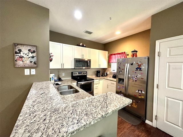 kitchen featuring sink, light stone counters, kitchen peninsula, stainless steel appliances, and white cabinets