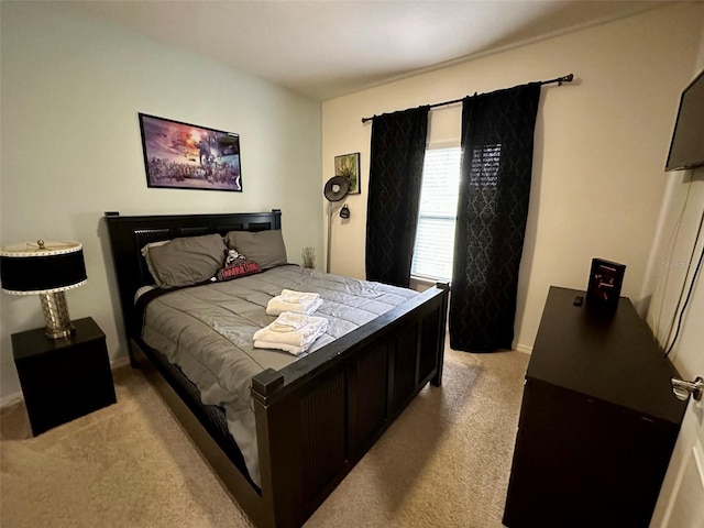 bedroom with light colored carpet