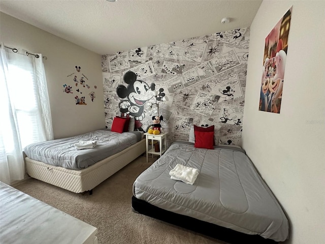 carpeted bedroom featuring a textured ceiling