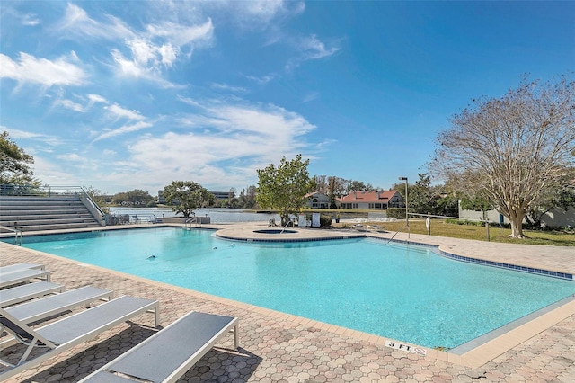 community pool featuring a patio and stairway