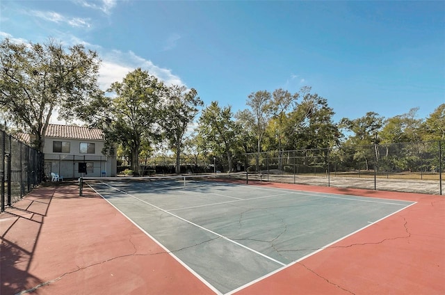 view of sport court featuring community basketball court and fence