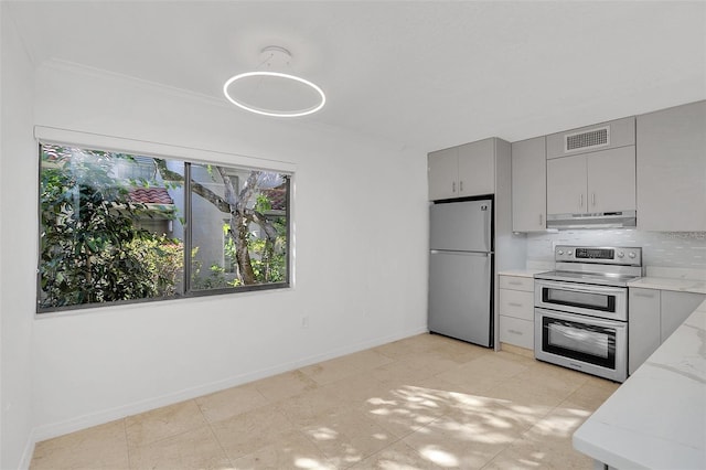 kitchen featuring ornamental molding, visible vents, appliances with stainless steel finishes, under cabinet range hood, and gray cabinetry