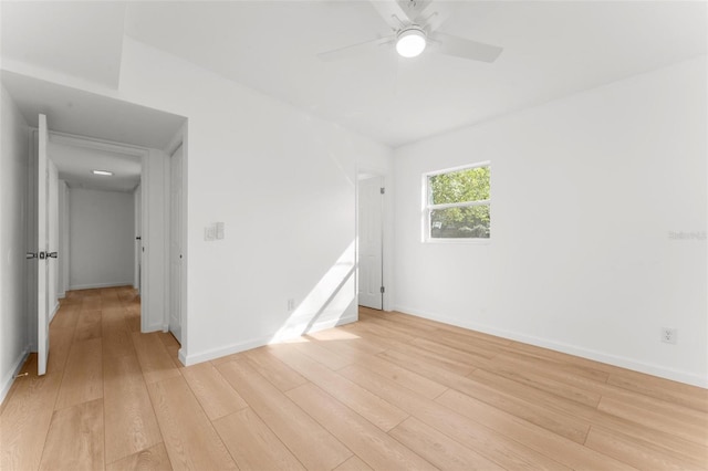 spare room with ceiling fan and light hardwood / wood-style floors