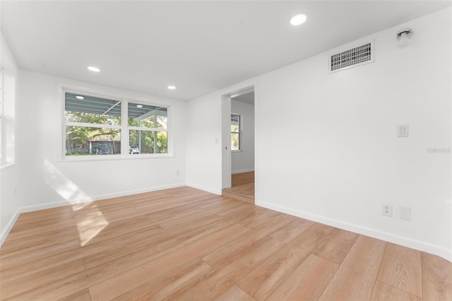 spare room with light hardwood / wood-style floors