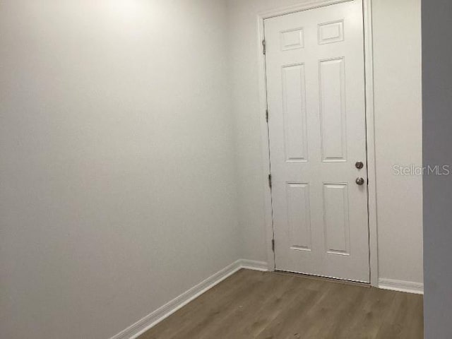 entryway with dark hardwood / wood-style floors