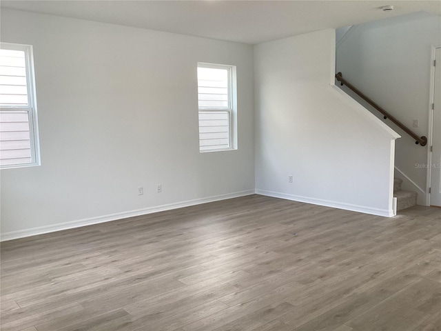 spare room featuring light hardwood / wood-style flooring