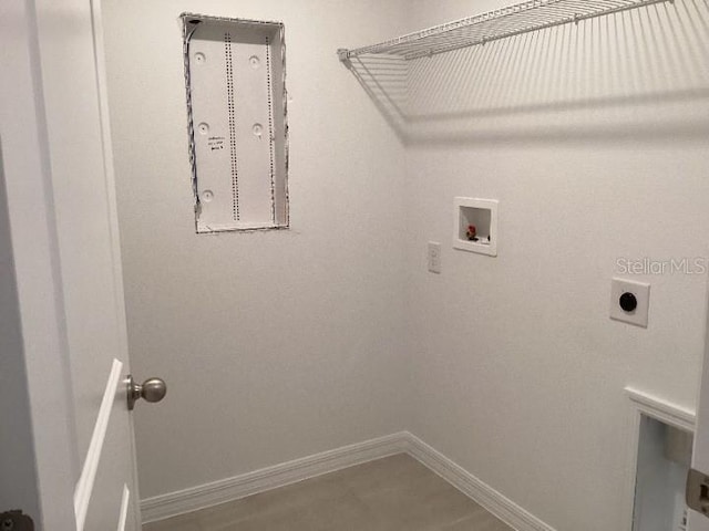 laundry room featuring tile patterned floors, washer hookup, and electric dryer hookup