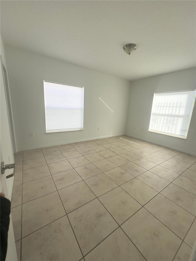 view of tiled spare room