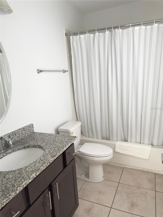 full bathroom with vanity, tile patterned floors, toilet, and shower / bathtub combination with curtain