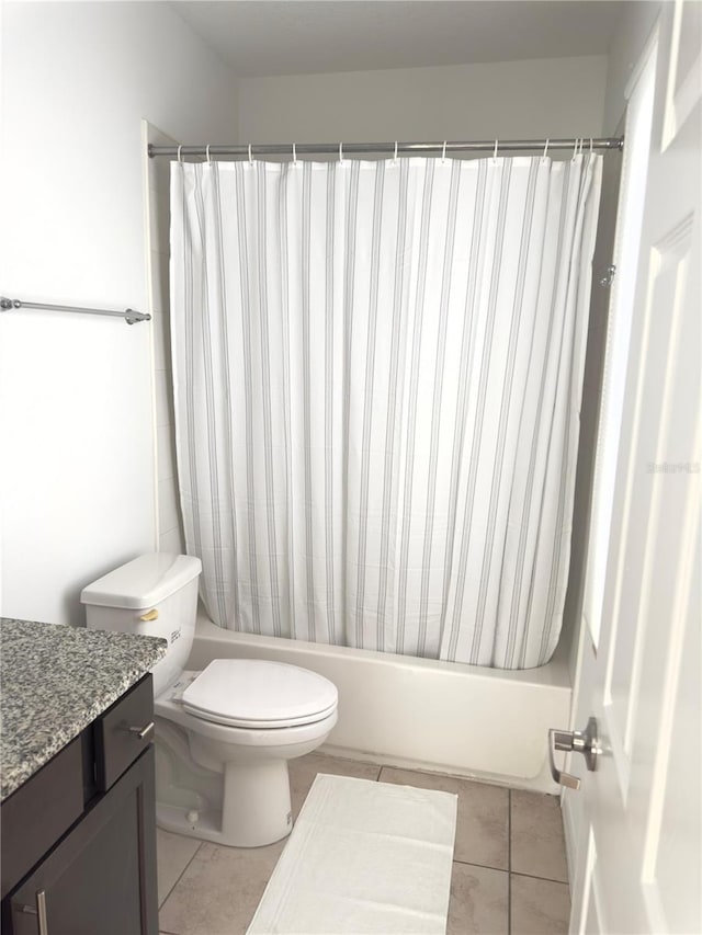 full bathroom featuring vanity, shower / tub combo, tile patterned flooring, and toilet