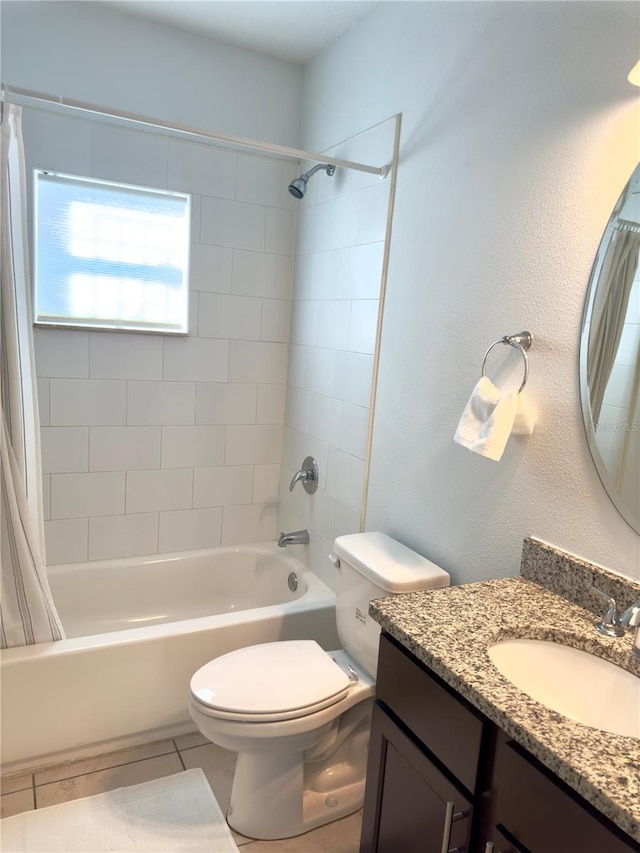 full bathroom with vanity, shower / bathtub combination with curtain, tile patterned floors, and toilet