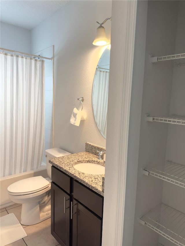 full bathroom with vanity, shower / bath combo, tile patterned floors, and toilet