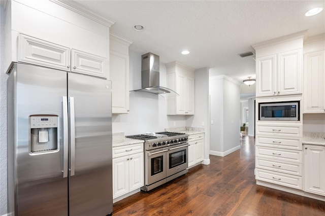 kitchen featuring white cabinetry, dark hardwood / wood-style flooring, light stone counters, stainless steel appliances, and wall chimney exhaust hood