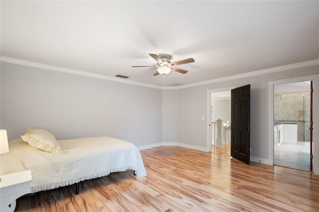 bedroom with ceiling fan, ornamental molding, ensuite bathroom, and light hardwood / wood-style flooring