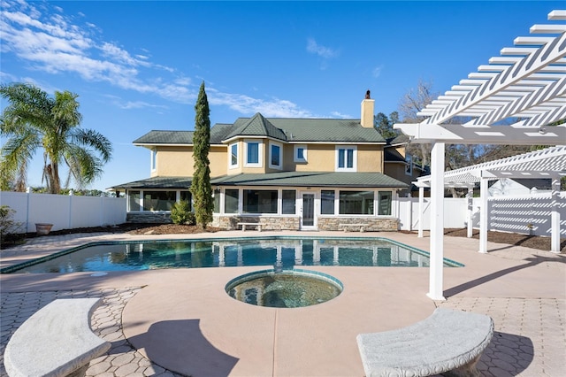 view of pool with an in ground hot tub, a pergola, and a patio