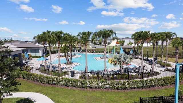 view of pool featuring a yard