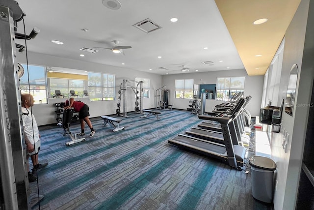 exercise room featuring ceiling fan and carpet flooring