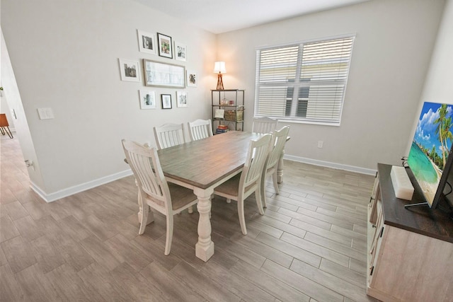 dining area with light hardwood / wood-style floors