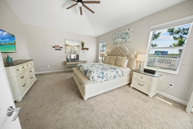 bedroom featuring multiple windows, light carpet, and ceiling fan