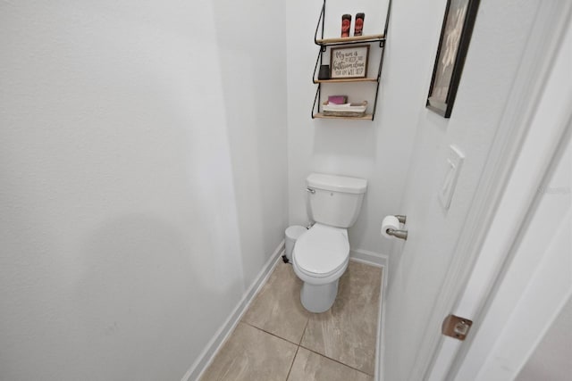 bathroom featuring tile patterned floors and toilet