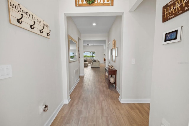 hall with light hardwood / wood-style flooring